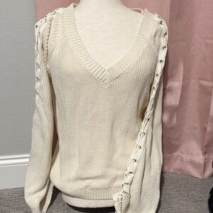 Guess v neck cream sweater ties on arm size large